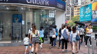 HONG KONG, CHINA – 2024/06/07: Pedestrians walk past the American multinational investment bank, Citibank or Citi, branch in Hong Kong.