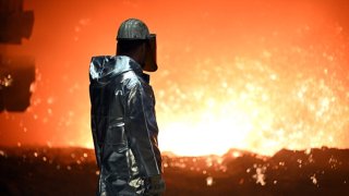 An employee stands at a blast furnace in North Rhine-Westphalia, Duisburg, Germany.