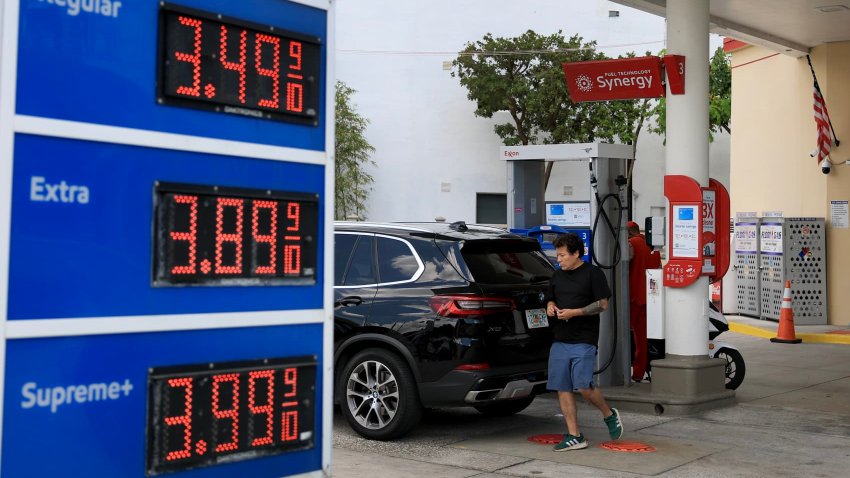 A customer gets fuel at an Exxon gas station on May 22, 2025 in Miami, Florida.