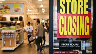 A store closing sign is displayed as customers shop during the last day of a store closing sale at a JOANN Fabric and Crafts location in a shopping mall following the company’s bankruptcy in Torrance, California, on May 27, 2025.
