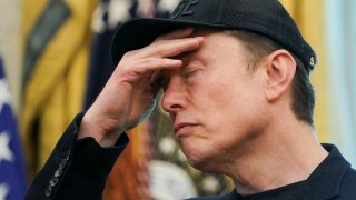 Elon Musk reacts during a press event with U.S. President Donald Trump (not pictured), at the White House in Washington, D.C., U.S., May 30, 2025.