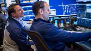 Traders work on the floor of the New York Stock Exchange on June 3, 2025.