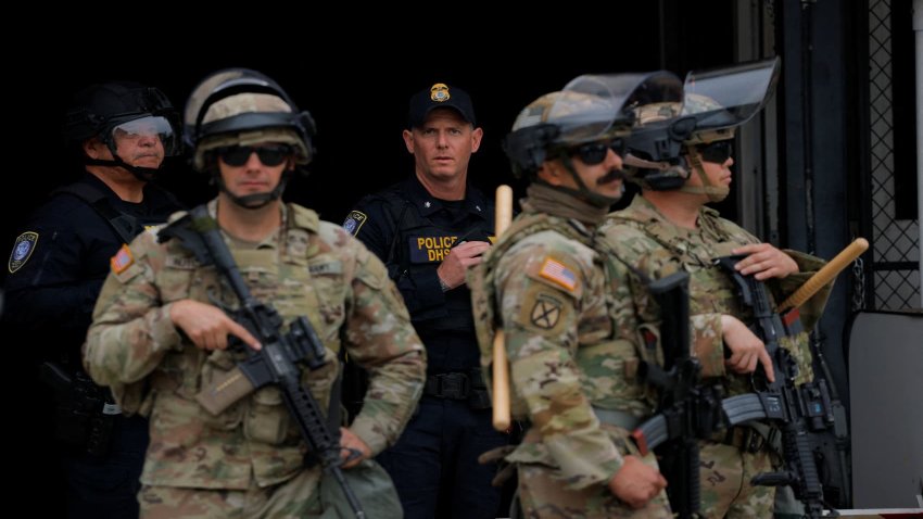 Members of the California National Guard stand outside the Edward R. Roybal federal building after their deployment by U.S. President Donald Trump, in response to protests against immigration sweeps, in Los Angeles on June 8, 2025.