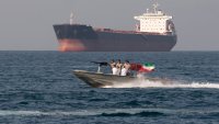 Iranian Navy soldiers at an armed speed boat in Persian Gulf near the strait of Hormuz about 1320km (820 miles) south of Tehran, April 30, 2019.