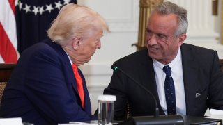 President Donald Trump, left, and Health and Human Services Secretary Robert F. Kennedy Jr. in the East Room of the White House, May 22, 2025, in Washington.