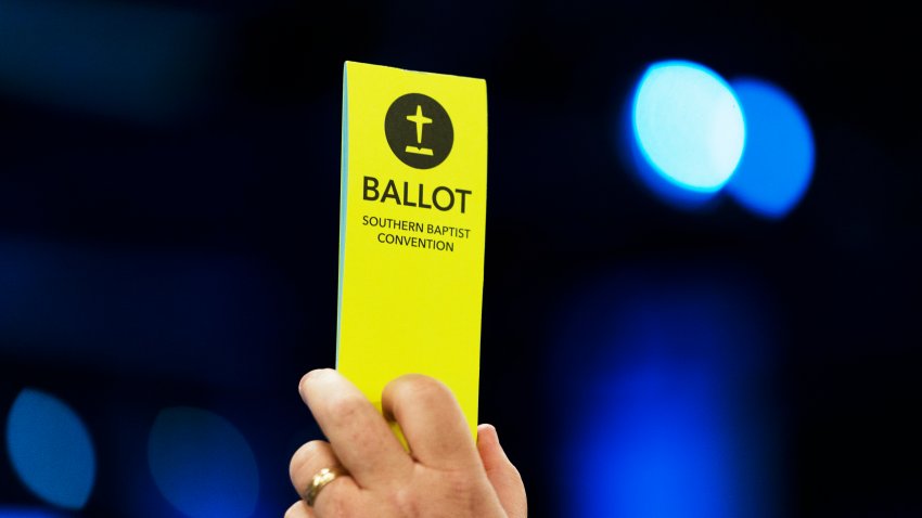 FILE - An attendee holds up a ballot during the Southern Baptist Convention's annual meeting in Anaheim, Calif., Tuesday, June 14, 2022.