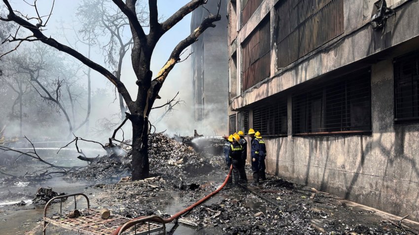 Firefighters work at the site of an airplane that crashed in India’s northwestern city of Ahmedabad in Gujarat state, Thursday, June 12, 2025.
