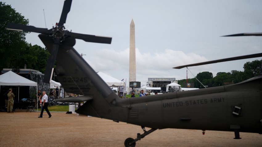 The Washington Monument behind a military helicopter during the US Army’s 250th Anniversary festival on the National Mall in Washington, DC, US, on Saturday, June 14, 2025. President Donald Trump’s pledge to exert US power around the world is being tested in Europe and the Middle East, but this weekend offers him a chance to display that power on American soil. Photographer: Eric Thayer/Bloomberg via Getty Images