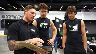 BUFFALO, NEW YORK – JUNE 7: Michael Misa #77 and Brady Martin #90 have receive instructions for testing from staff during the 2025 NHL Scouting Combine at the LECOM Harborcenter on June 7, 2025 in Buffalo, New York. (Photo by Bill Wippert/NHLI via Getty Images)