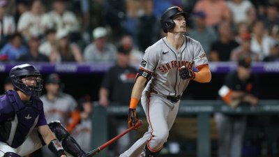 DENVER, COLORADO – JUNE 10: Mike Yastrzemski #5 of the San Francisco Giants hits a RBI single against the Colorado Rockies in the ninth inning at Coors Field on June 10, 2025 in Denver, Colorado. (Photo by Matthew Stockman/Getty Images)