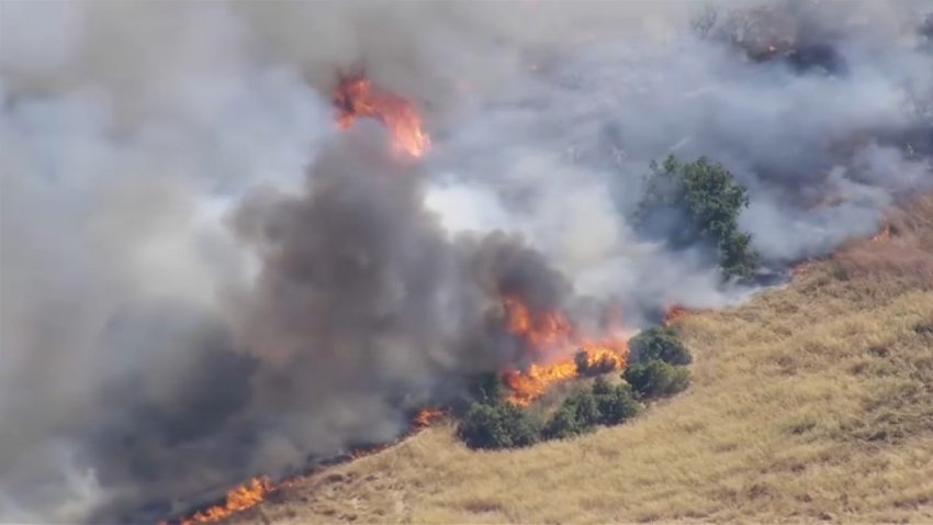 A brush fire burns in San Jose. (June 17, 2025)