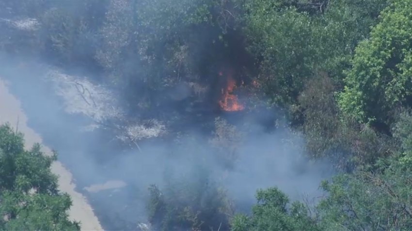 A small brush fire burns in San Jose. (June 12, 2025)