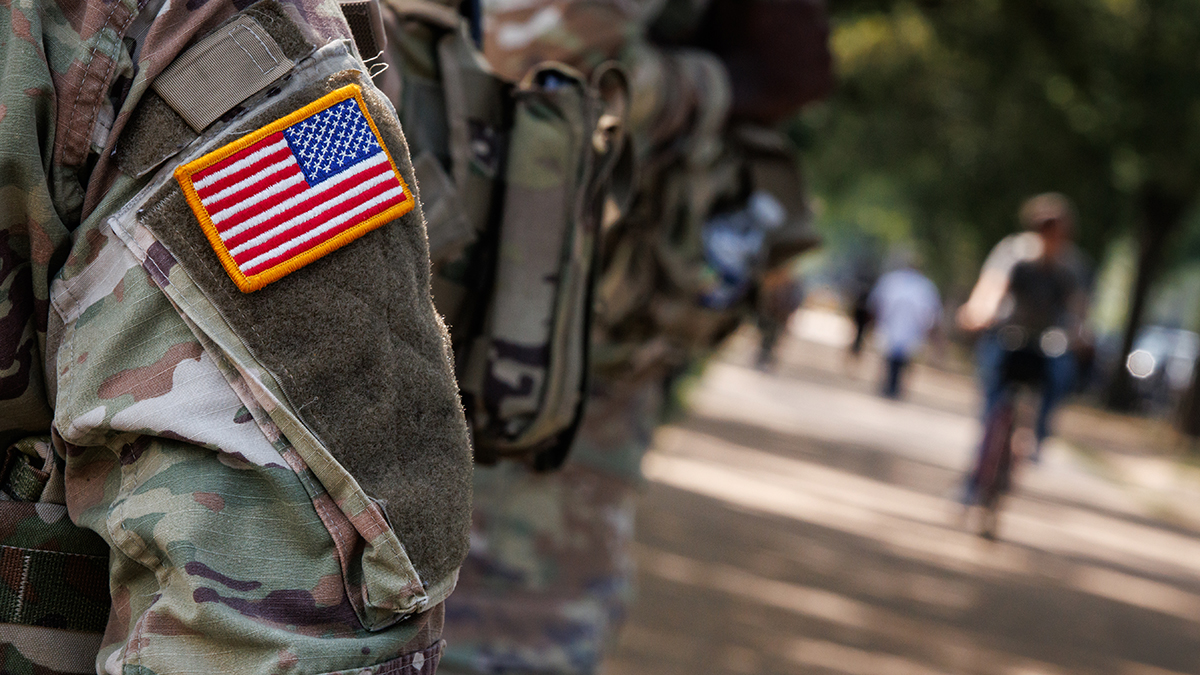 National Guard vehicle crashes with car on Capitol Hill, trapping 1 person