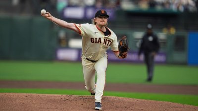 Aug 11, 2025; San Francisco, California, USA; San Francisco Giants starting pitcher Logan Webb (62) delivers a pitch against the San Diego Padres during the first inning at Oracle Park. Mandatory Credit: Neville E. Guard-Imagn Images