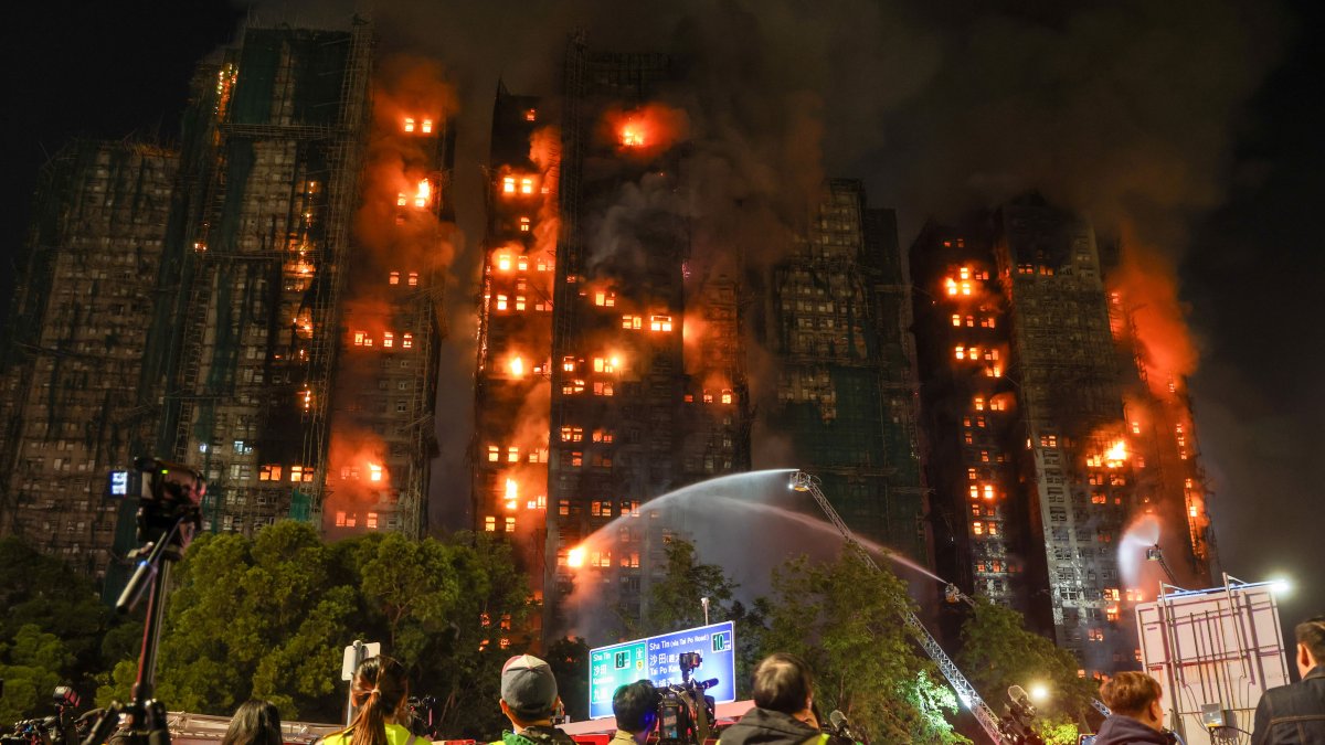 Death toll in Hong Kong apartment complex blaze rises to 146 as the city mourns