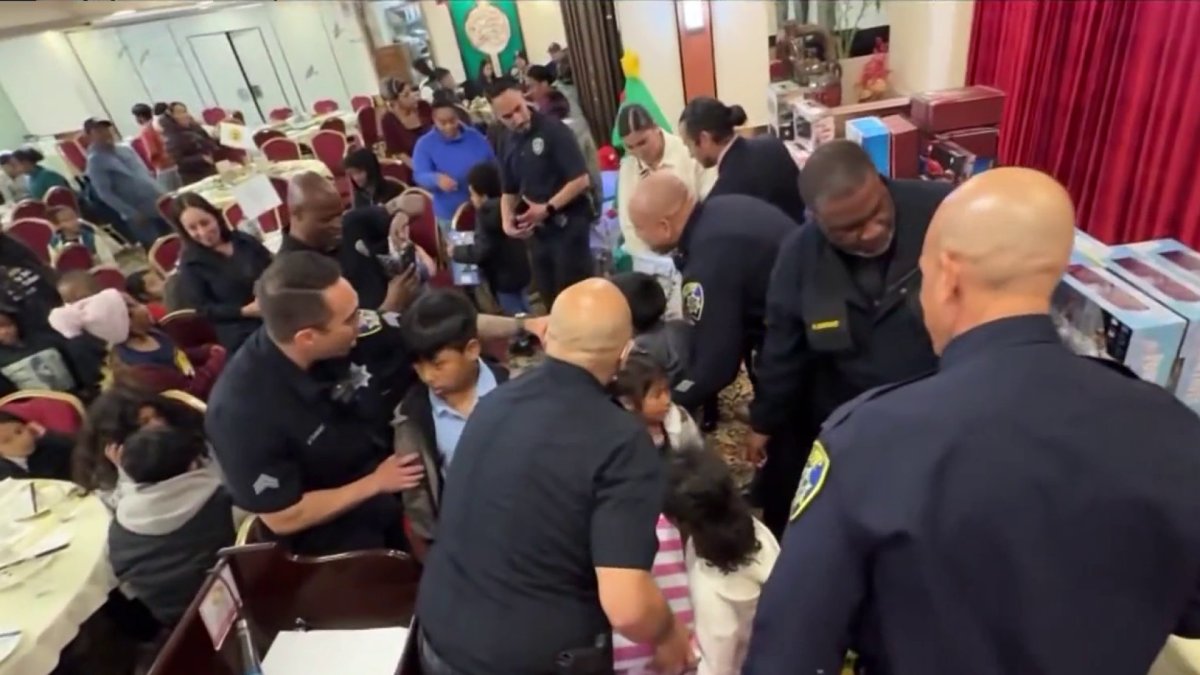Oakland PD hands out gifts to over 100 children