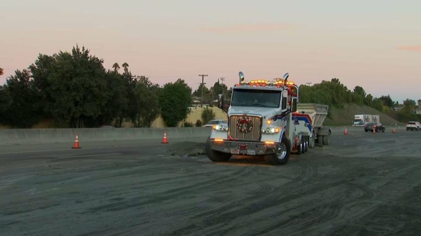 Sand is strewn across all lanes of northbound Highway 101 in South San Jose, snarling the morning commute. (Dec. 4, 2025)