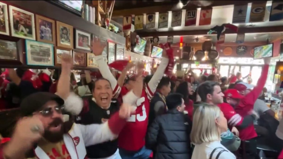 49ers fans in San Francisco celebrate after win against Eagles