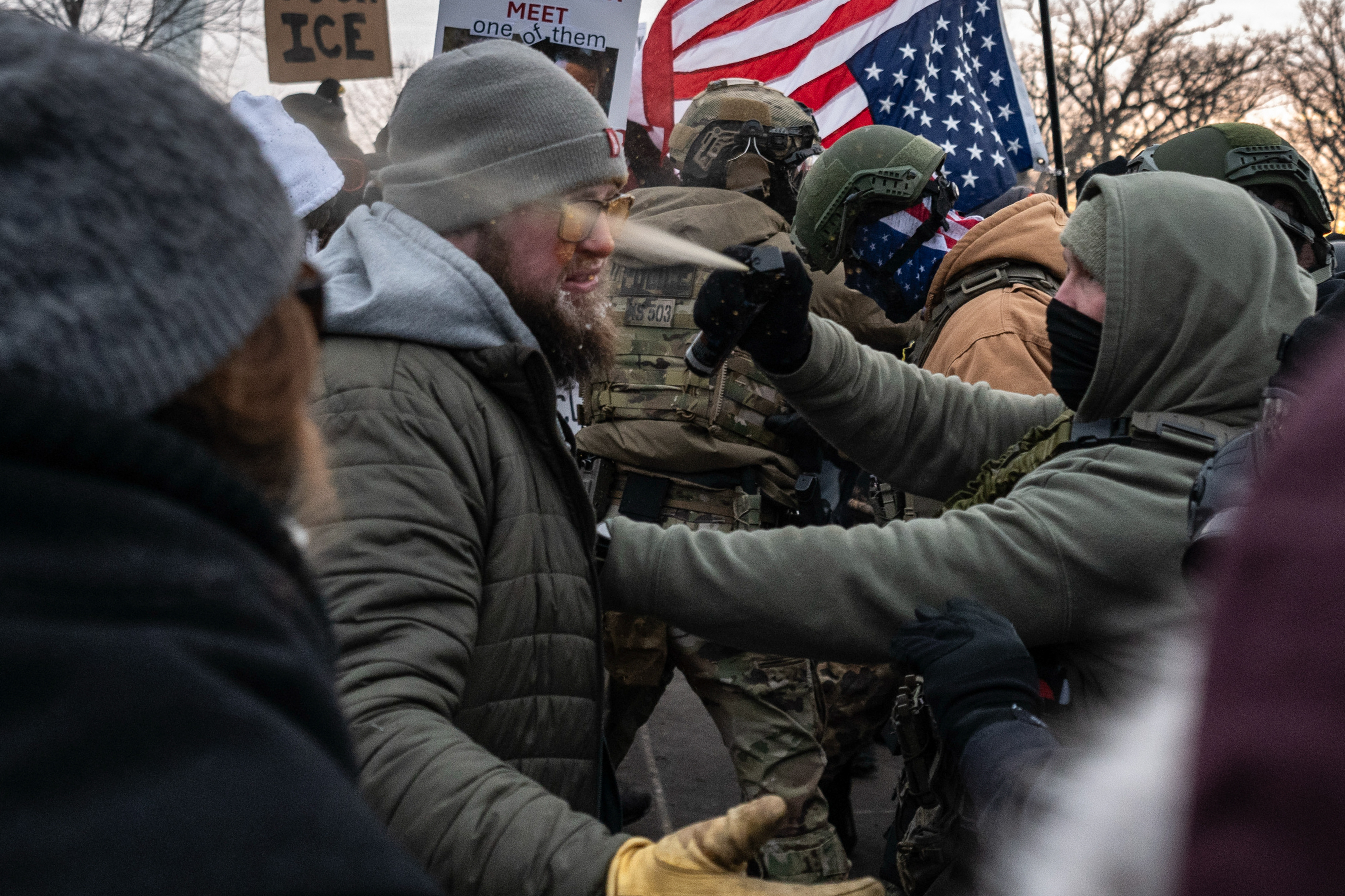 Federal law enforcement officers use pepper spray against a demonstrator during a protest outside the Bishop Henry Whipple Federal Building in St. Paul, Minnesota, US, on Saturday, Jan. 17, 2026.