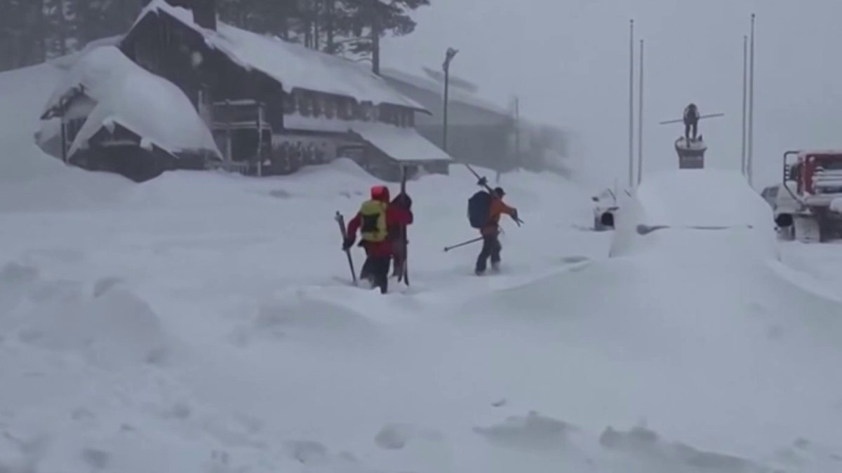 Officials work to lower risk of deadly slides to recover bodies of California avalanche victims