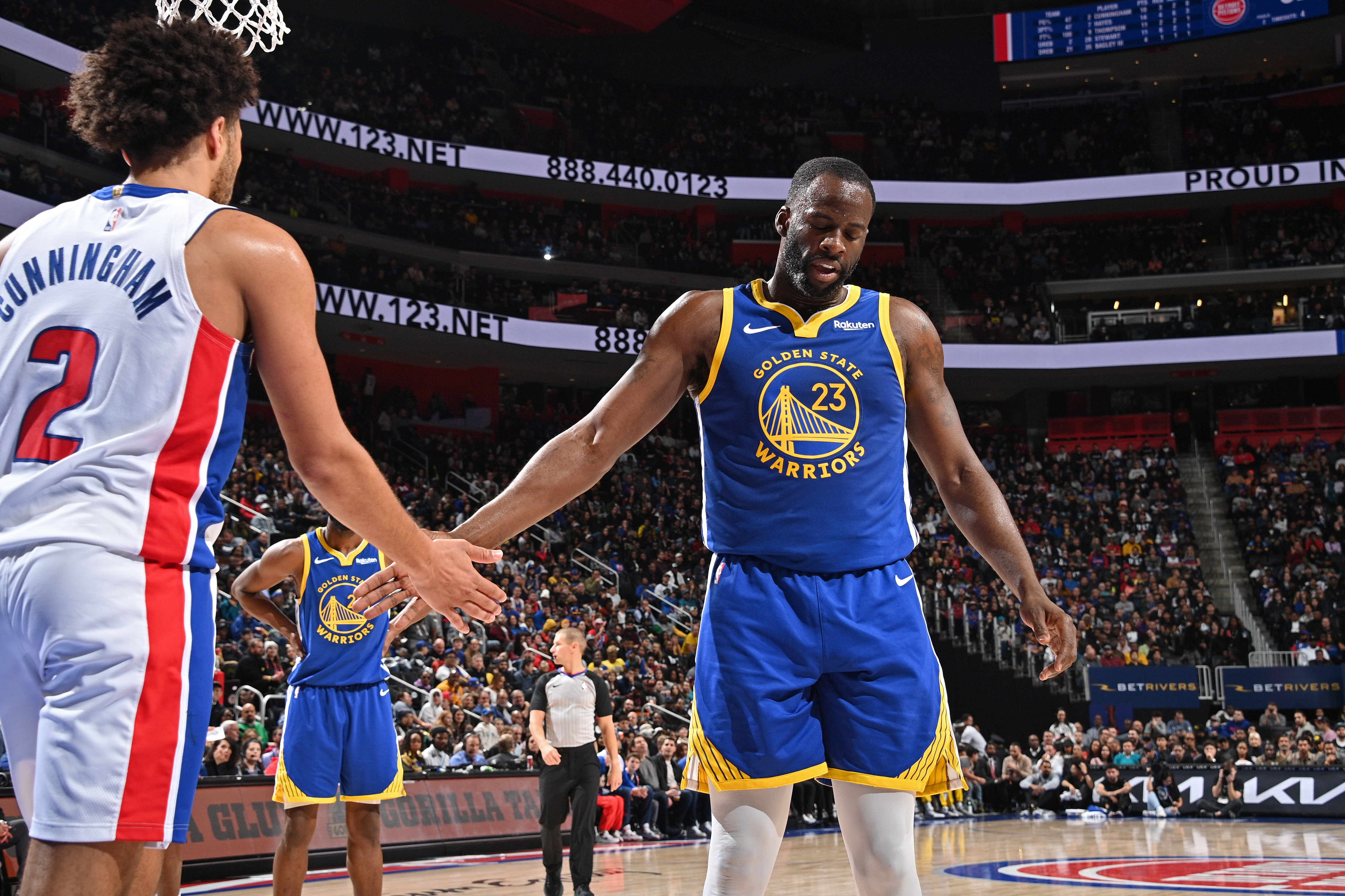 DETROIT, MI – NOVEMBER 6: Cade Cunningham #2 of the Detroit Pistons and Draymond Green #23 of the Golden State Warriors high five during the game on November 6, 2023 at Little Caesars Arena in Detroit, Michigan. NOTE TO USER: User expressly acknowledges and agrees that, by downloading and/or using this photograph, User is consenting to the terms and conditions of the Getty Images License Agreement. Mandatory Copyright Notice: Copyright 2023 NBAE (Photo by Chris Schwegler/NBAE via Getty Images)