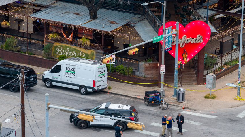 In an aerial view, members of the FBI and local law enforcement patrol and perform an investigation after a mass shooting outside of Buford’s bar in downtown on March 01, 2026 in Austin, Texas. Three people are dead and 14 others are hospitalized following a mass shooting early Sunday morning.