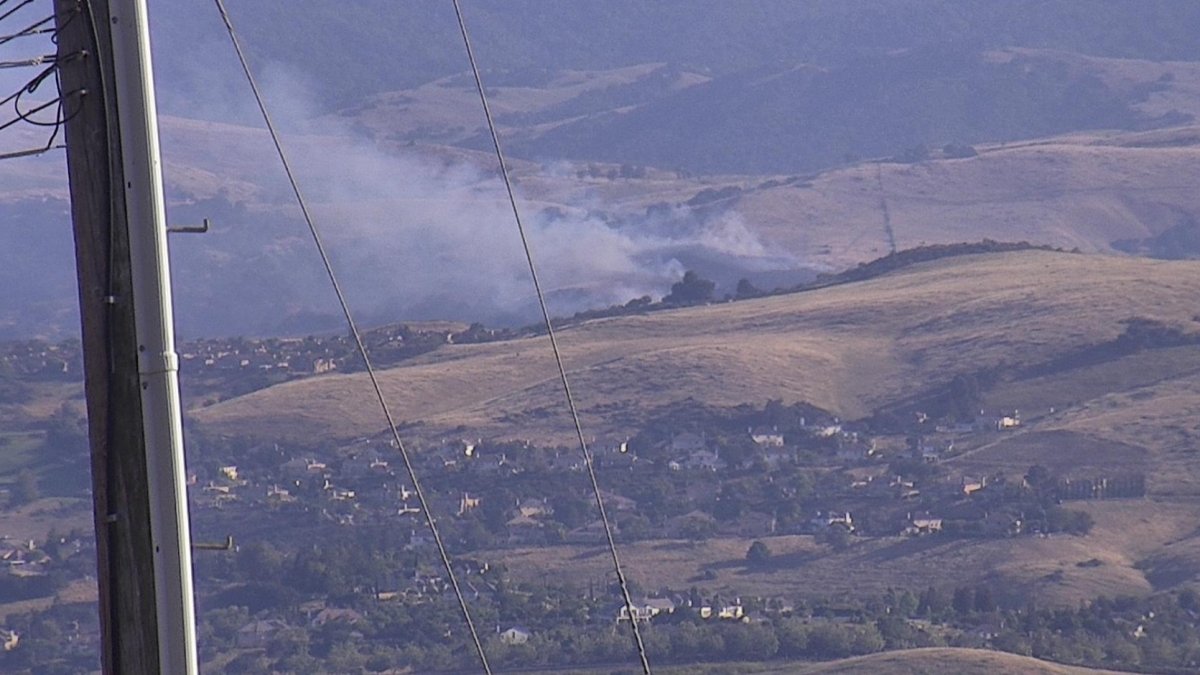 Fire crews fight a 19-acre fire in the South San Jose hills