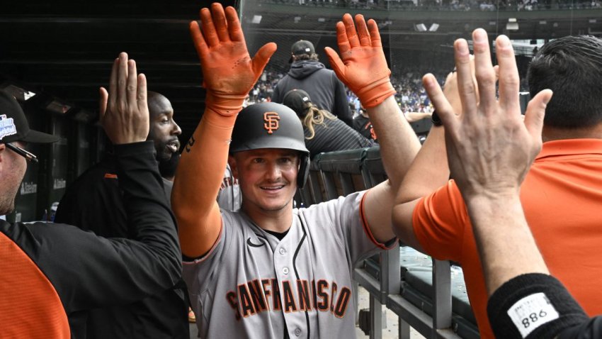 Jun 5, 2026; Chicago, Illinois, USA;  San Francisco Giants third baseman Matt Chapman (26) celebrates in the dugout after hitting a three run home run against the Chicago Cubs during the sixth inning  at Wrigley Field. Mandatory Credit: Matt Marton-Imagn Images