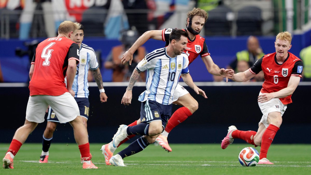 Lionel Messi scores twice as Argentina clinches spot in World Cup knockout round