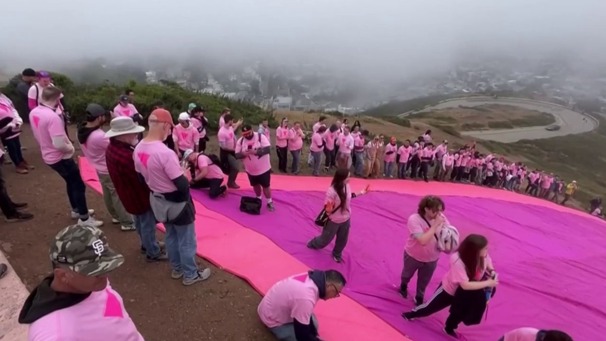 Volunteers begin setting up San Francisco's Pink Triangle for Pride Month