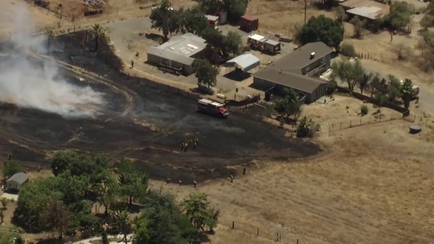 Crews mop up a brush fire in South San Jose. (July 7, 2026)