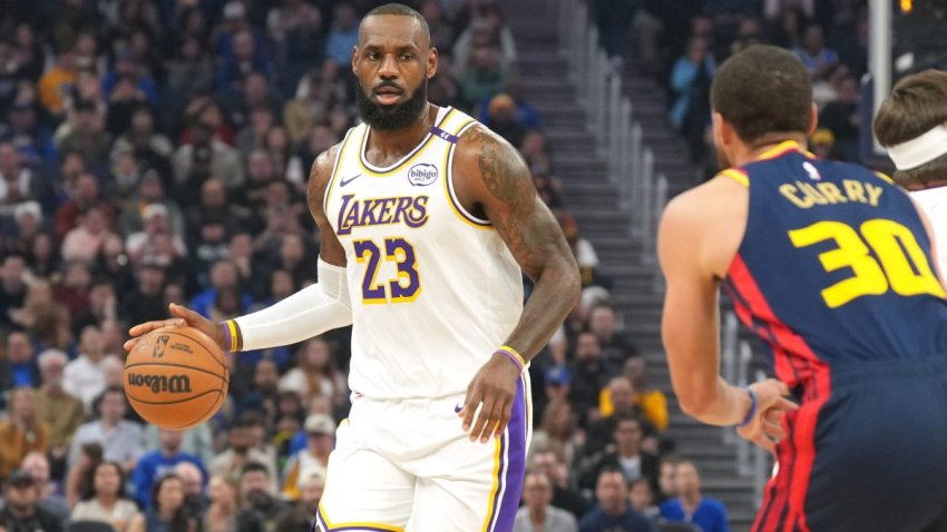 Jan 25, 2025; San Francisco, California, USA; Los Angeles Lakers forward LeBron James (23) dribbles against Golden State Warriors guard Stephen Curry (30) during the first quarter at Chase Center. Mandatory Credit: Darren Yamashita-Imagn Images