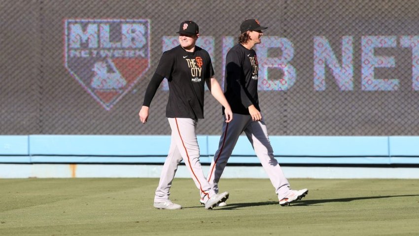 LOS ANGELES, CA – OCTOBER 12: Logan Webb #62 and Kevin Gausman #34 of the San Francisco Giants look on before Game 4 of the 2021 Divisional Series during Game 4 of the NLDS between the San Francisco Giants and the Los Angeles Dodgers at Dodgers Stadium on Tuesday, October 12, 2021 in Los Angeles, California. (Photo by Rob Leiter/MLB Photos via Getty Images)