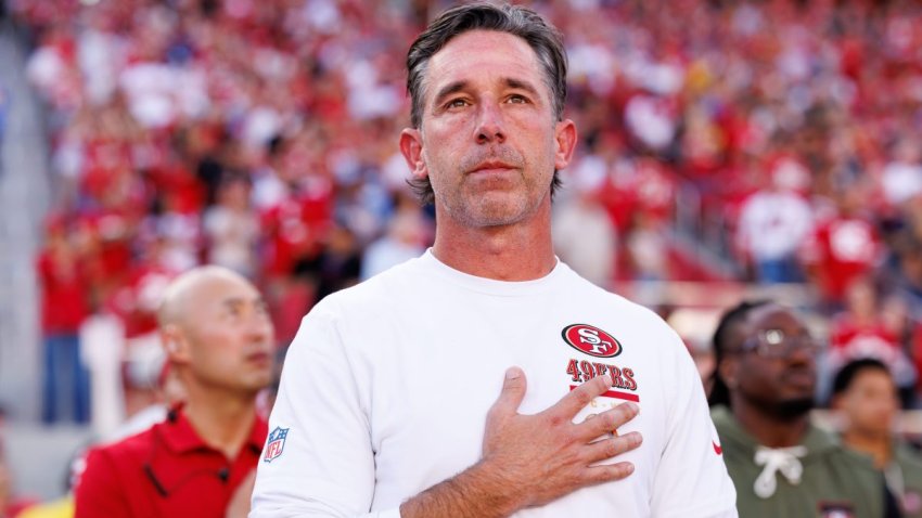 SANTA CLARA, CALIFORNIA – NOVEMBER 09: Head coach Kyle Shanahan of the San Francisco 49ers stands on the sidelines during the national anthem prior to an NFL football game against the Los Angeles Rams at Levi’s Stadium on November 09, 2025 in Santa Clara, California. (Photo by Brooke Sutton/Getty Images)