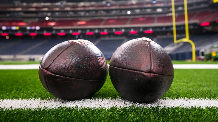 Footballs are placed on the field
