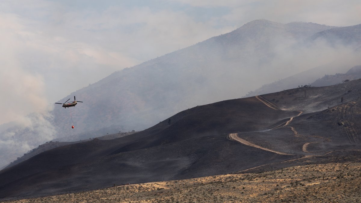 Firefighters make progress against a Nevada wildfire that's destroyed more than 30 homes