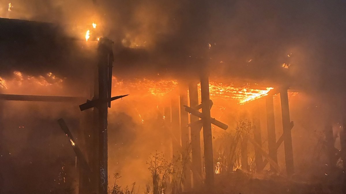 Abandoned railway trestle near EBMUD plant in Oakland catches fire