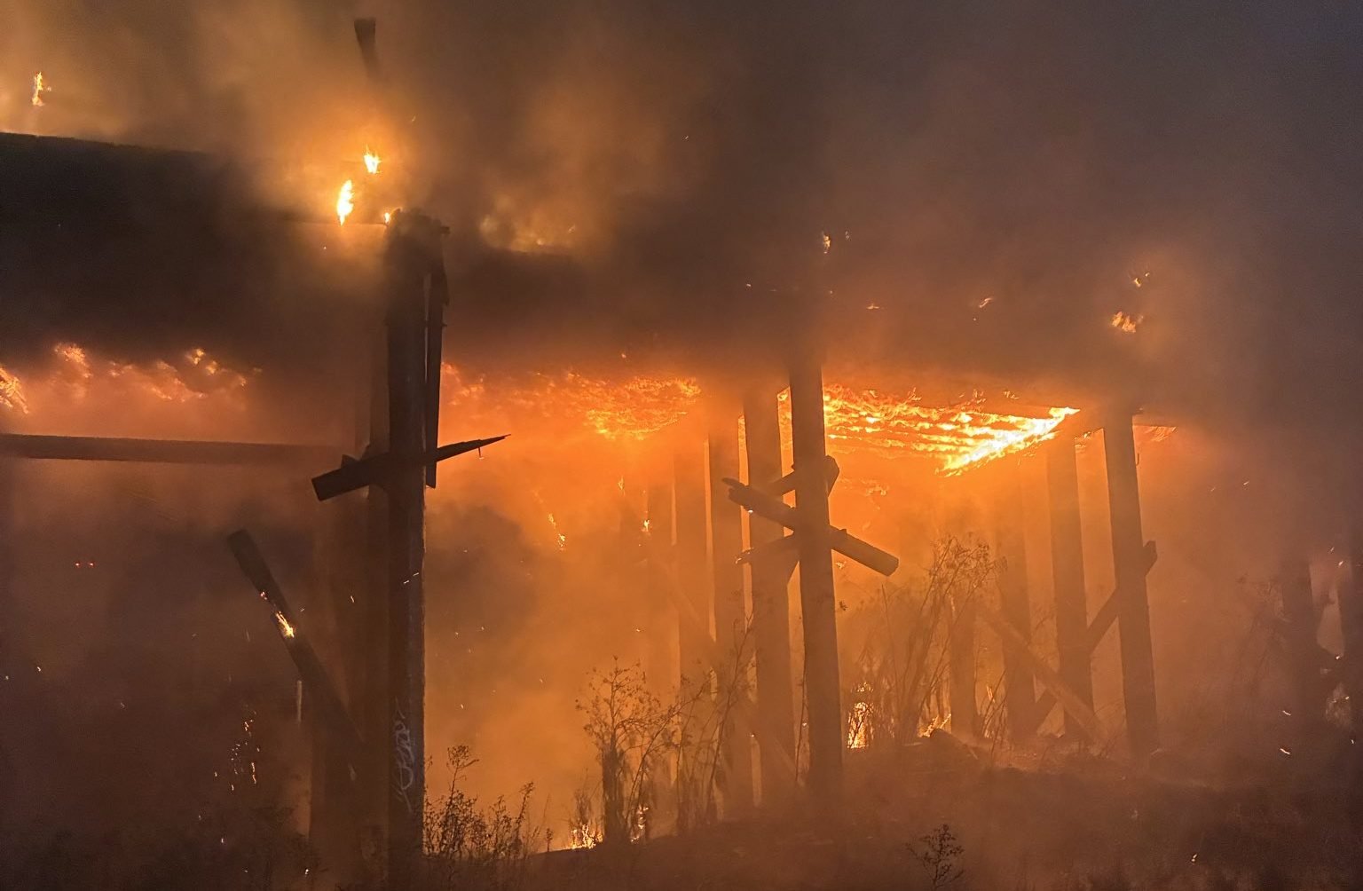 Abandoned railway trestle near EBMUD plant in Oakland catches fire