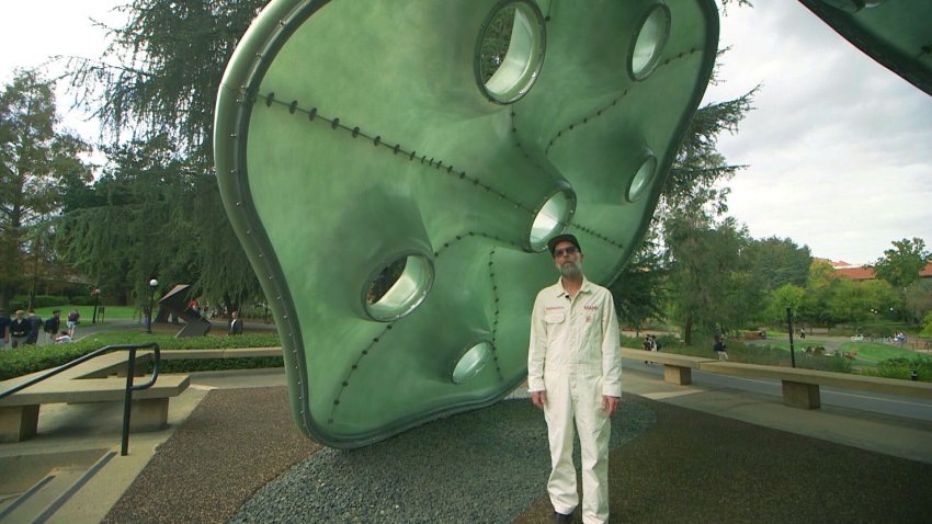 Stanford Public Art Ranger Mark Shunney explained an artwork by Alia Farid called Amulets on the Stanford University campus.