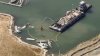 Crews remove derelict boats from Oakland Estuary