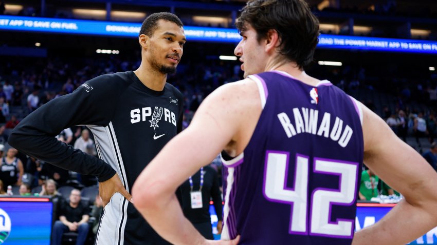 Mar 17, 2026; Sacramento, California, USA; San Antonio Spurs forward Victor Wembanyama (1) and Sacramento Kings center Maxime Raynaud (42) talk after the game at Golden 1 Center. Mandatory Credit: Sergio Estrada-Imagn Images
