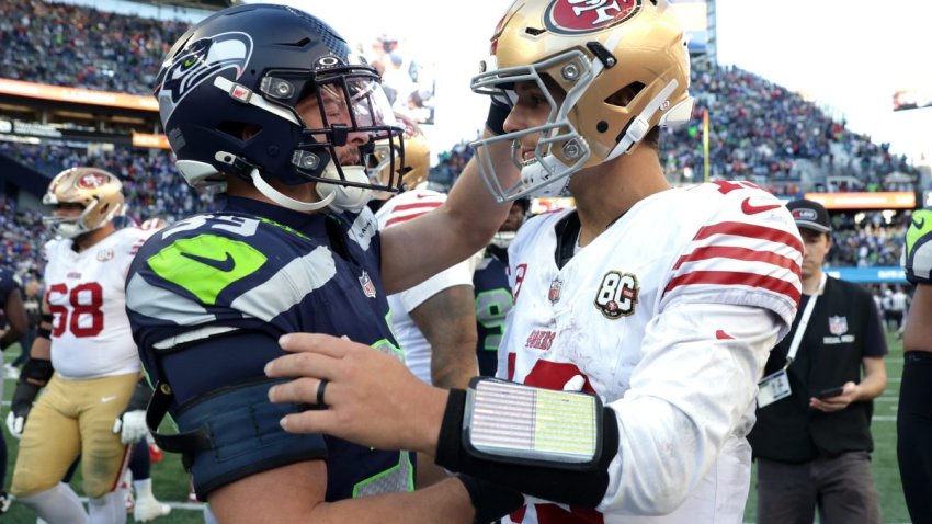Oct 11, 2026; Seattle, Washington, USA;  Seattle Seahawks safety Ty Okada (39) greets San Francisco 49ers quarterback Brock Purdy (13) on the field after a game at Lumen Field.  Mandatory Credit: Joe Nicholson-Imagn Images