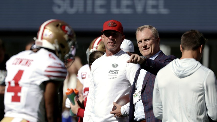 Oct 11, 2026; Seattle, Washington, USA;  San Francisco 49ers general manager John Lynch (right) chats with head coach Kyle Shanahan on the sideline before a game against the Seattle Seahawks at Lumen Field.  Mandatory Credit: Joe Nicholson-Imagn Images