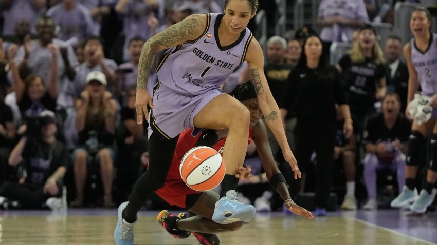 Golden State Valkyries forward Gabby Williams (1) runs toward the ball against Atlanta Dream guard Rhyne Howard during the first half of Game 1 of the WNBA basketball finals, Saturday, Oct. 17, 2026, in San Francisco. (AP Photo/Jeff Chiu)