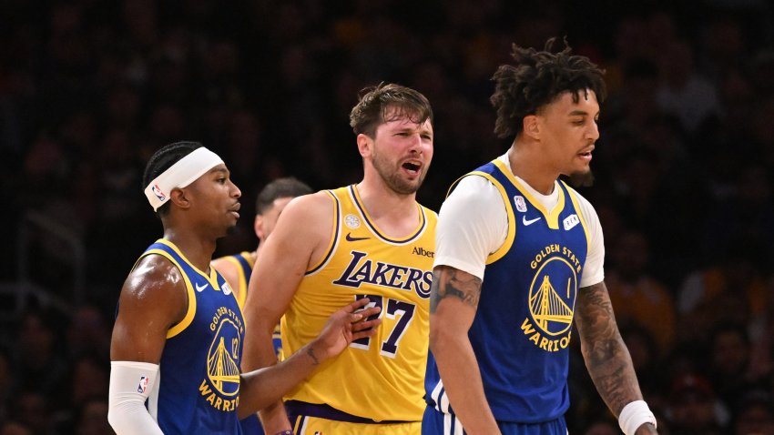 Los Angeles,  – October 21:  Guard Luka Doncic #77 of the Los Angeles Lakers reqacts after a foul by forward Yaxel Lendeborg #1 of the Golden State Warriors as guard Brandon Williams #12 of the Golden State Warriors tries seperate in the first half of a NBA playoff basketball game at Crypto.com Arena in Los Angeles on Wednesday, October 21, 2026.  (Photo by Keith Birmingham/MediaNews Group/Pasadena Star-News via Getty Images)