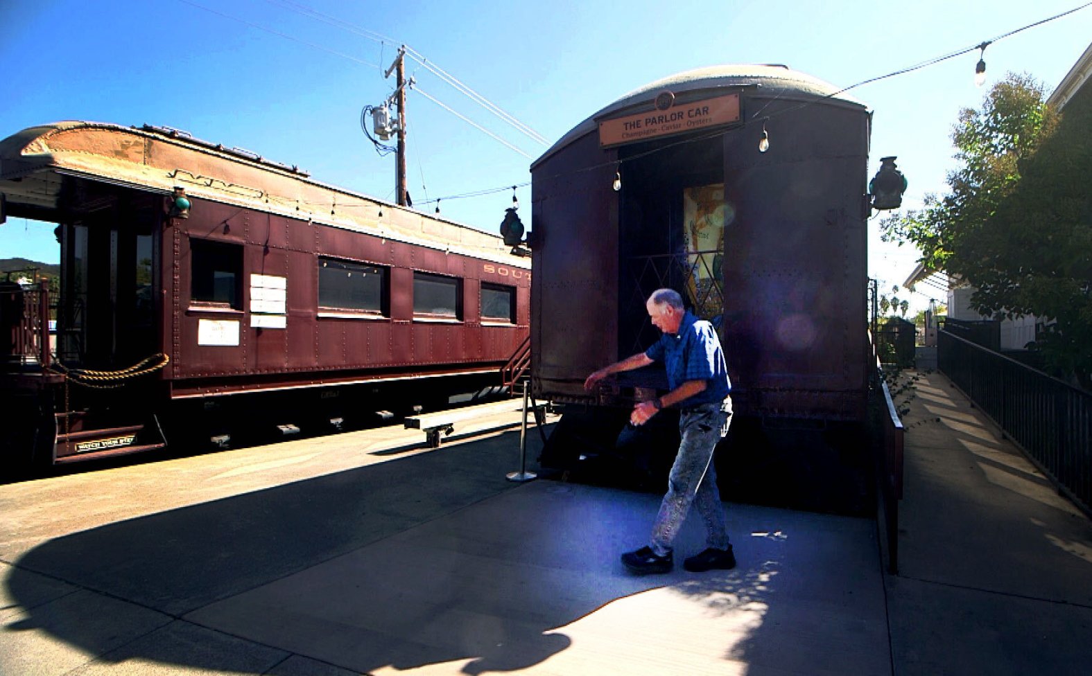 Eric Hanson shows the spot where the new Robert Louis Stevenson bench and sculpture will sit in front of the Calistoga Depot.