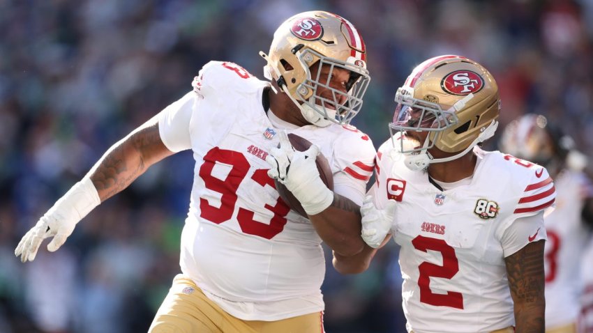 SEATTLE, WASHINGTON – OCTOBER 11: Gracen Halton #93 of the San Francisco 49ers celebrates with Deommodore Lenoir #2 after recovering a fumble and scoring a touchdown against the Seattle Seahawks during the second quarter at Lumen Field on October 11, 2026 in Seattle, Washington. (Photo by Steph Chambers/Getty Images)