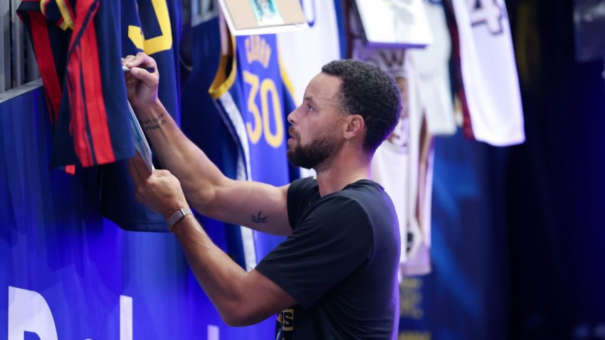 SAN FRANCISCO, CALIFORNIA – OCTOBER 06: Stephen Curry #30 of the Golden State Warriors signs autographs before their preseason game against the Los Angeles Lakers at Chase Center on October 06, 2026 in San Francisco, California. NOTE TO USER: User expressly acknowledges and agrees that, by downloading and/or using this photograph, user is consenting to the terms and conditions of the Getty Images License Agreement.  (Photo by Ezra Shaw/Getty Images)