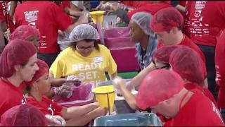 Volunteers to Honor 9/11 Victims, Pack Meals for the Hungry