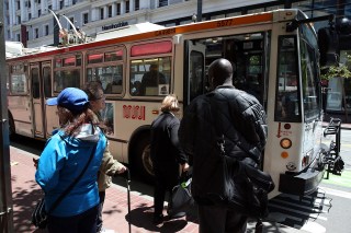 Man Sitting on San Francisco Bus Lights Woman's Hair on Fire